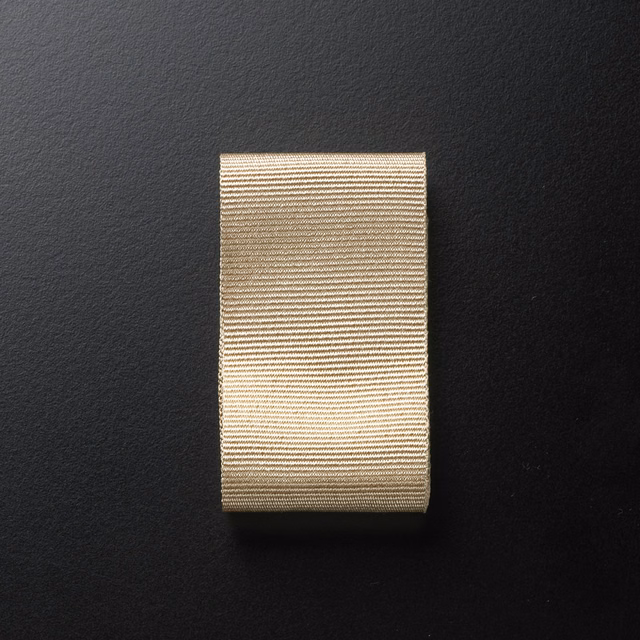Warm cream textile swatch with fine beige-brown horizontal ribbing and subtle texture