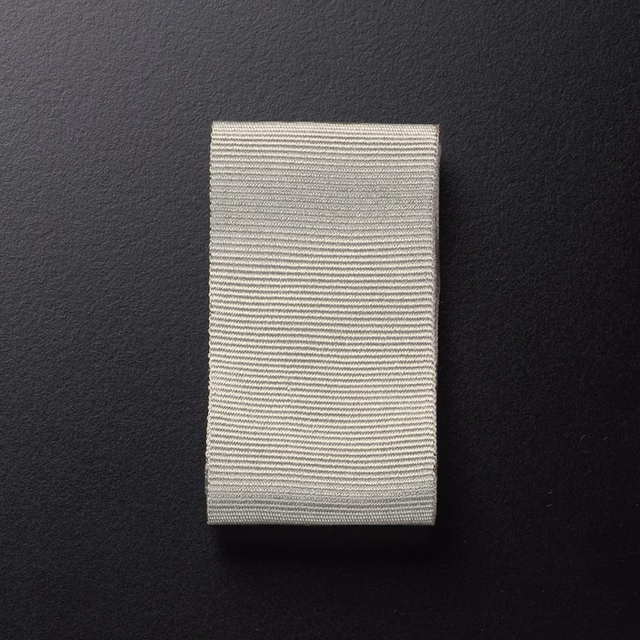 Warm marzipan cream swatch with densely spaced horizontal woven ribs