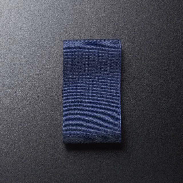 Deep mirtillo-blue ribbon swatch with fine horizontal ribs and subtle woven texture