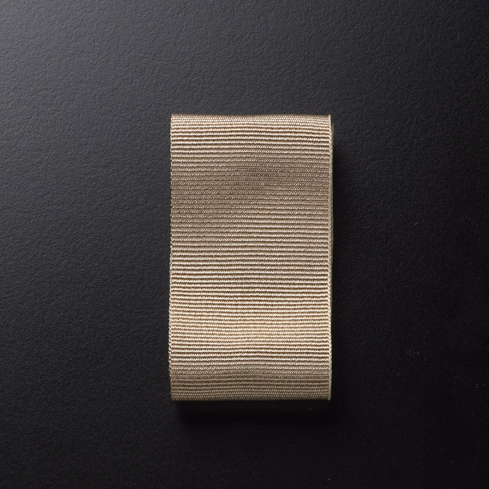 Warm taupe and cream ribbon with dense horizontal ribbed weave on black