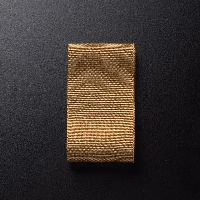 Warm hazelnut Ribbon Nocciola fabric with tightly spaced horizontal ribs and soft sheen