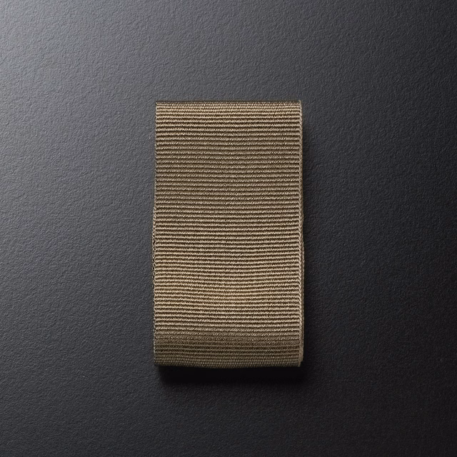 Warm taupe-brown woven swatch with fine horizontal ribs and shadowed edges