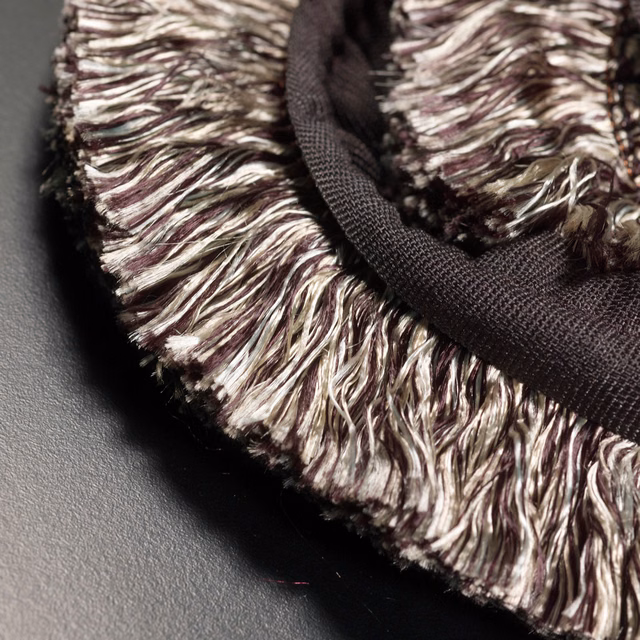 Ivory, taupe and plum wavy fringe with a deep brown woven edge