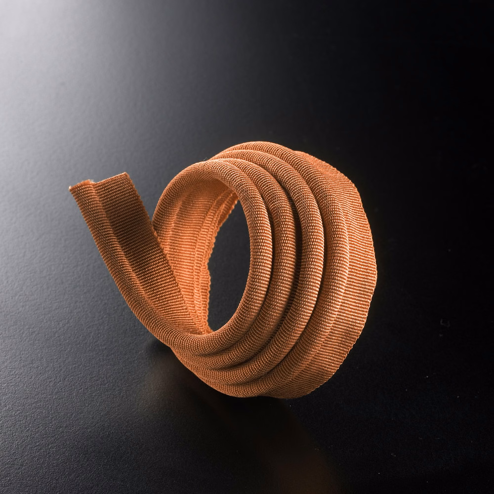 Tightly coiled ribbed lipcord in warm terracotta orange with coppery highlights