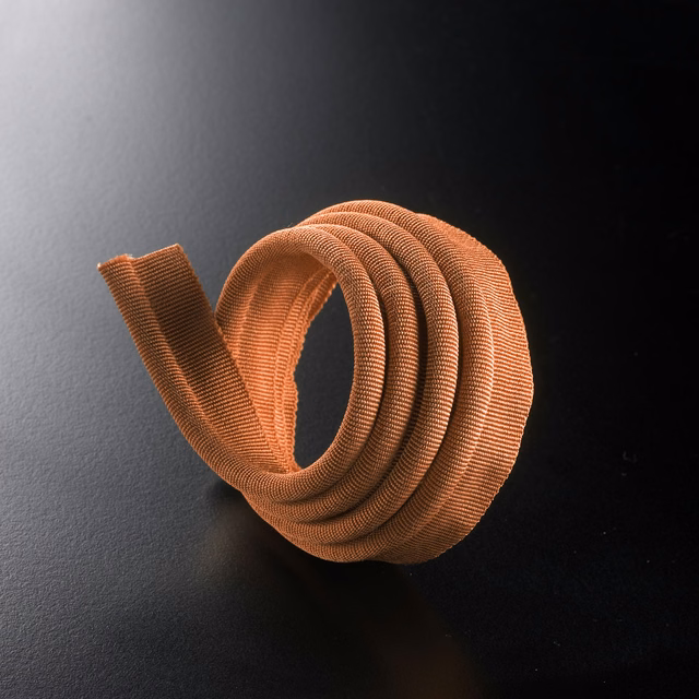 Tightly coiled ribbed lipcord in warm terracotta orange with coppery highlights