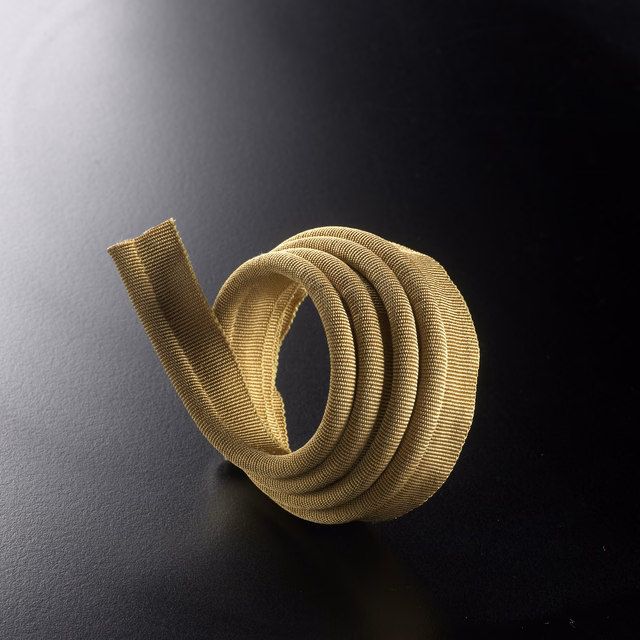 Golden-beige ribbed lipcord coiled to show its rounded, light-catching texture