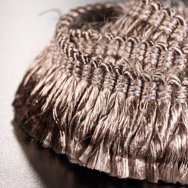 Mauve taupe fringe with glossy strands and raised looped woven band