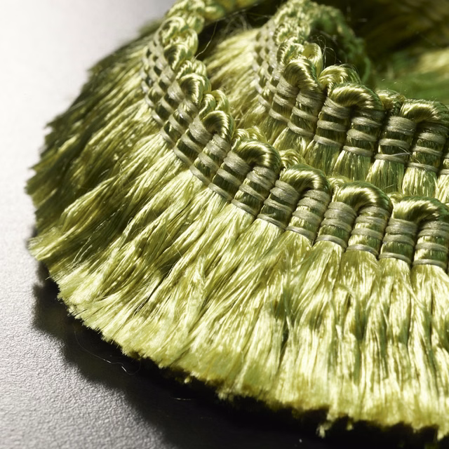 Lustrous olive-green fringe with wrapped loops and long feathery tassels