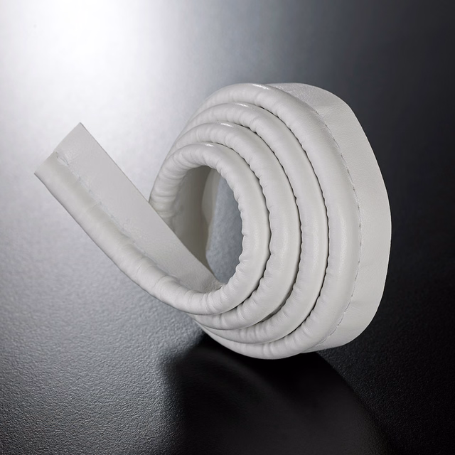 Rolled white padded lipcord showing rounded ridges and a smooth flat edge