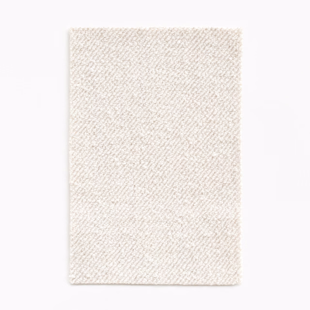 Natural cream upholstery fabric with a fine diagonal woven texture