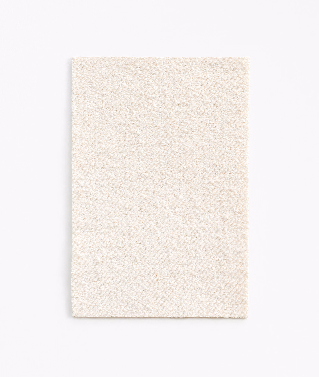 Warm white finely woven upholstery swatch with a softly pebbled surface