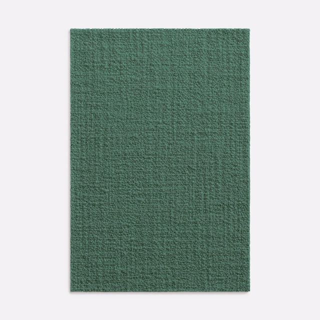 Muted agave-green woven upholstery swatch showing a finely nubby, variegated texture