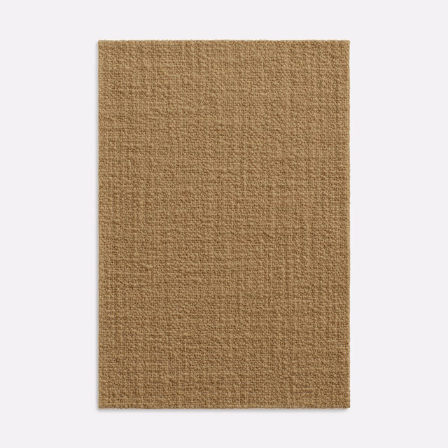 Warm camel-brown fabric swatch with a fine, irregular woven texture