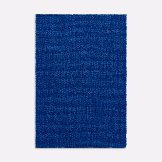 Saturated cobalt-blue woven upholstery swatch with subtle vertical tonal variation
