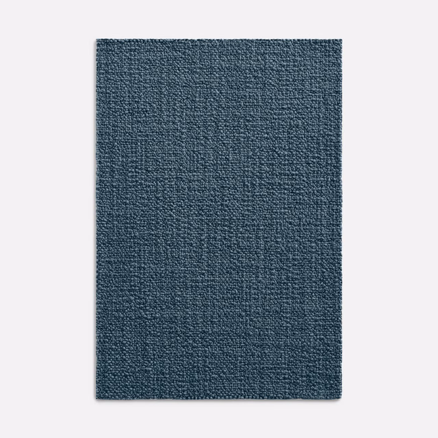 Deep denim blue plain woven upholstery fabric with fine pebbled texture