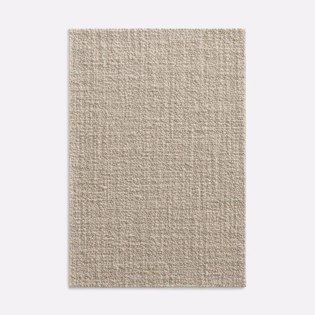 Warm oatmeal-beige Dedar textile with a close, softly irregular woven surface