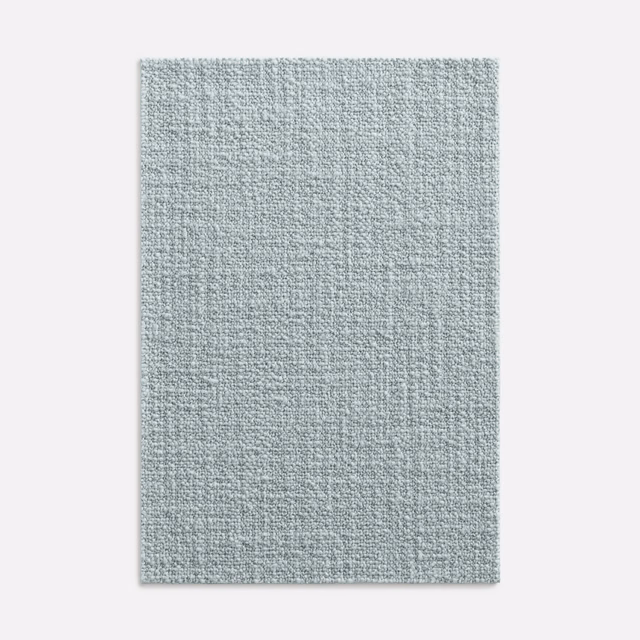 Pale glacier blue-grey woven fabric with a fine, softly mottled surface