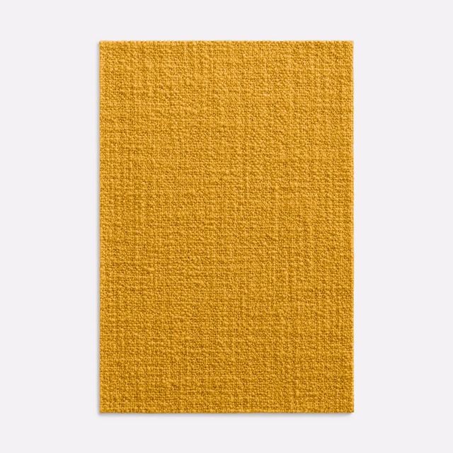 Close view of deep mustard-yellow woven fabric with a softly slubbed tactile surface