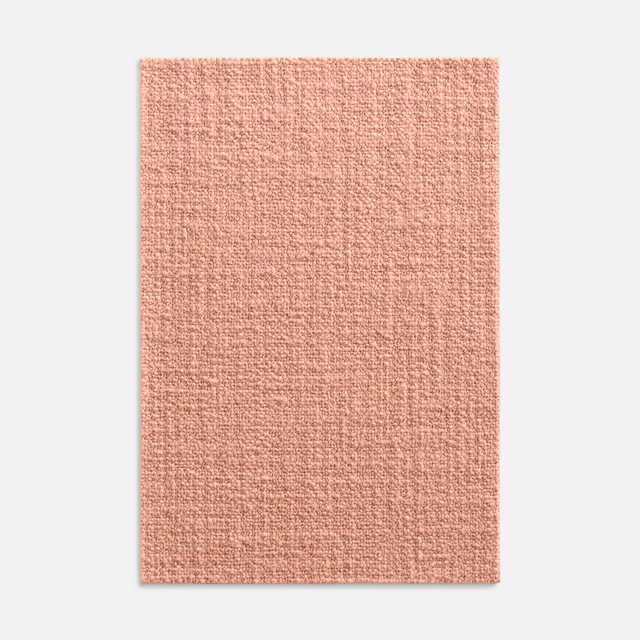 Muted salmon-pink upholstery swatch with a fine, tactile woven texture