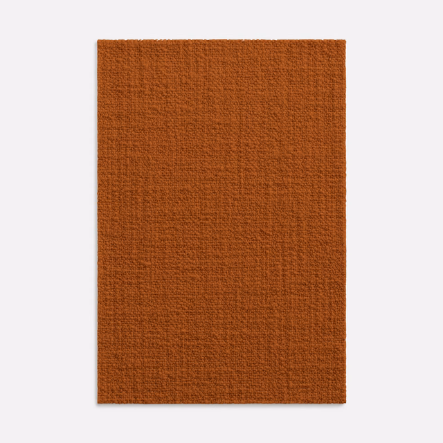 Burnt terracotta textile swatch with a close, subtly ridged woven surface