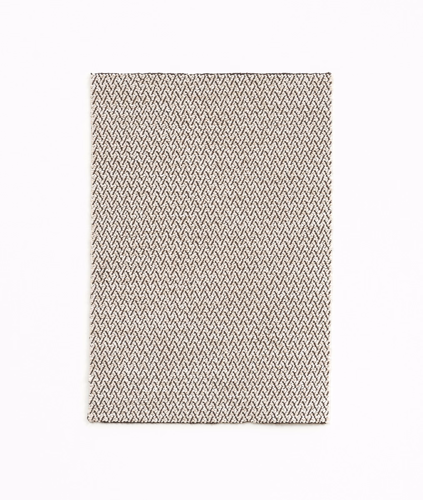 Warm coconut cream textile with a fine, dark herringbone weave