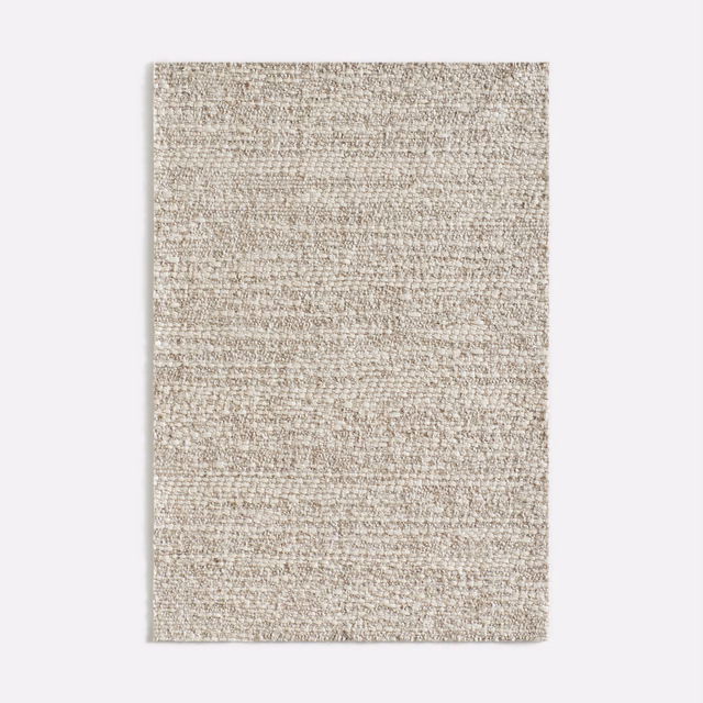 Pale ivory woven upholstery with horizontal nubs and fine beige-grey flecks