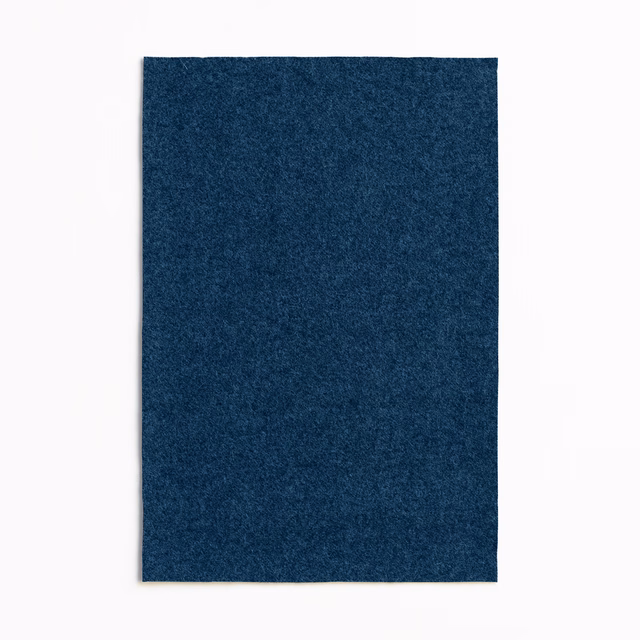 Deep indigo upholstery swatch with a subtly mottled, softly textured surface