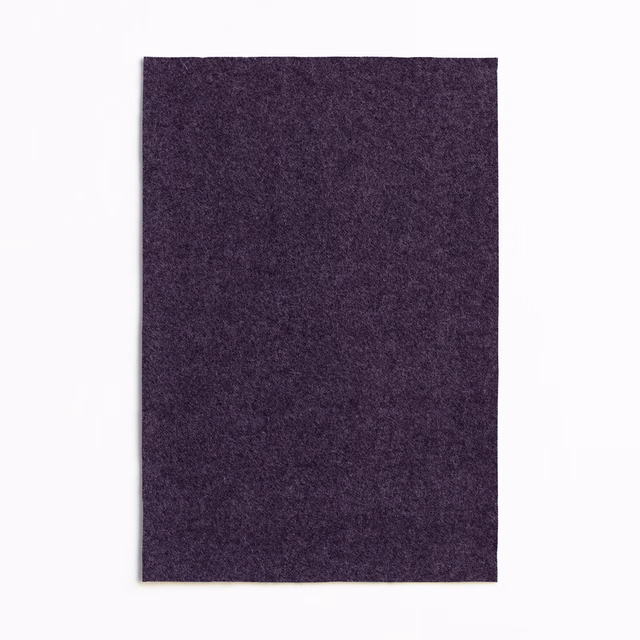Deep aubergine-purple textile with a softly mottled, dense woven surface