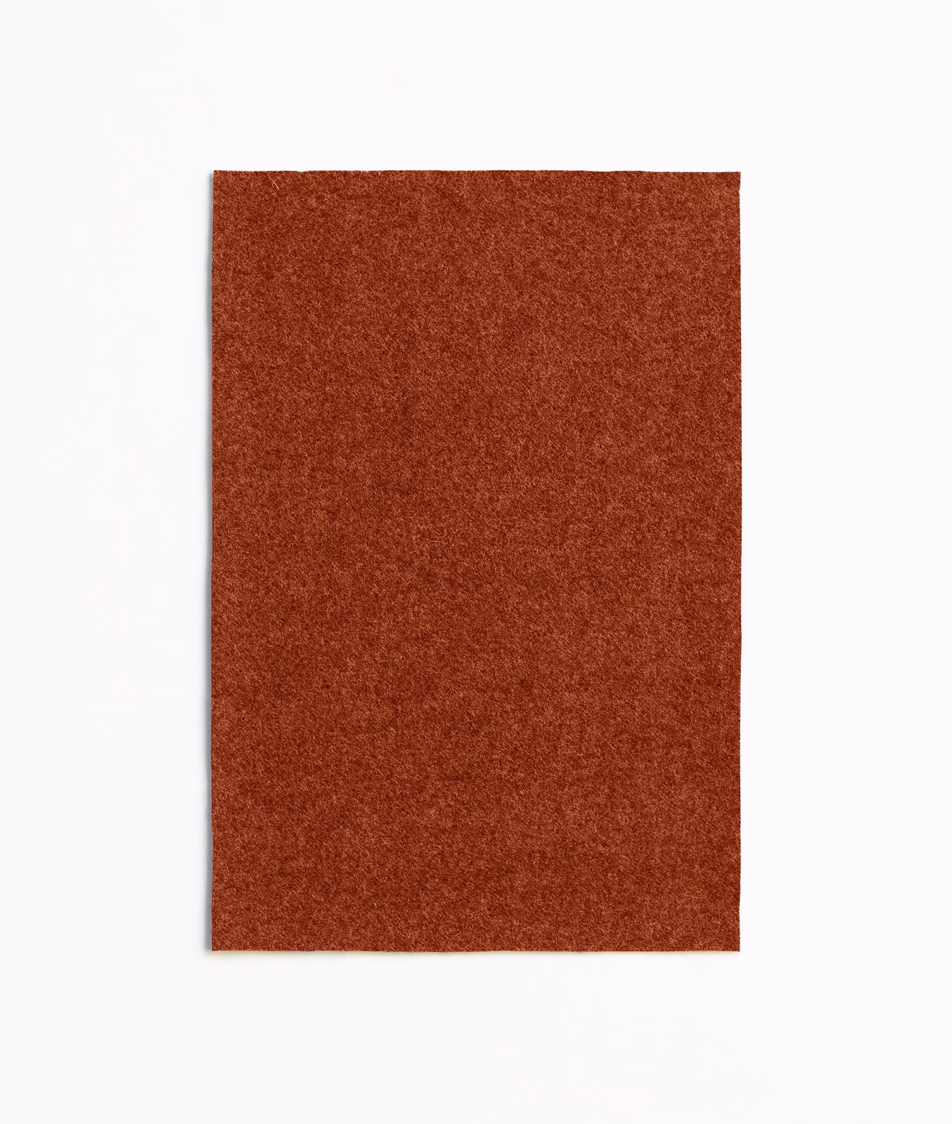 Rust paprika upholstery swatch showing a dense, softly mottled woven texture