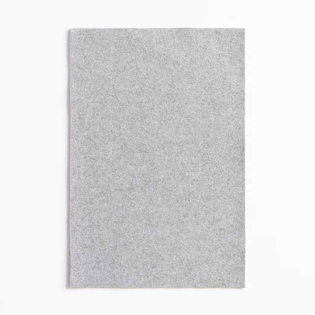 Cool pale grey swatch with a fine peppered weave and softly brushed texture