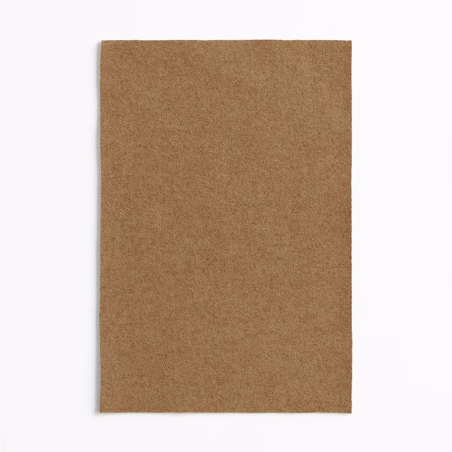 Warm tobacco-brown plain swatch with a softly brushed, mottled surface