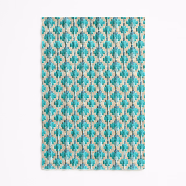 Teal and ivory diamond lattice with mottled woven texture on a rectangular swatch
