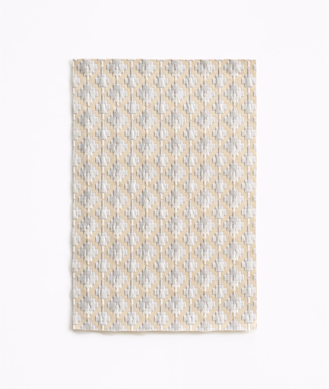 Pale pearl-beige woven swatch with repeating cream and grey diamond motifs
