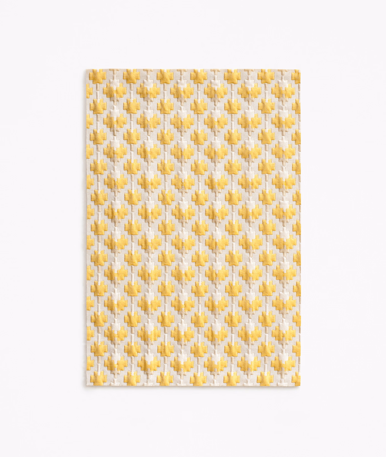 Ivory woven fabric with repeated small sunflower-gold geometric motifs