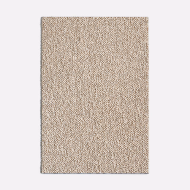 Pale stone-beige fabric swatch with dense, irregular nubby woven texture