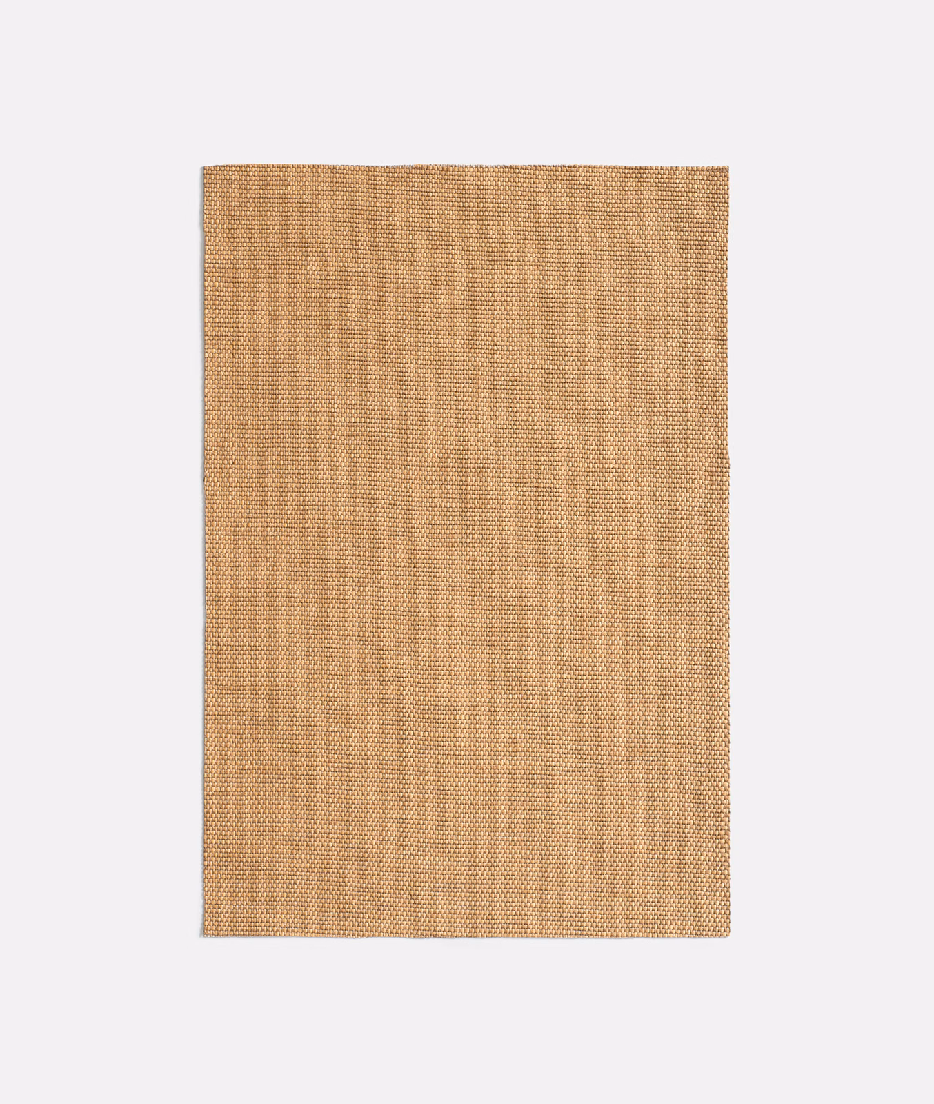 Close view of warm rattan-tan fabric with fine woven texture and subtle vertical tonal lines