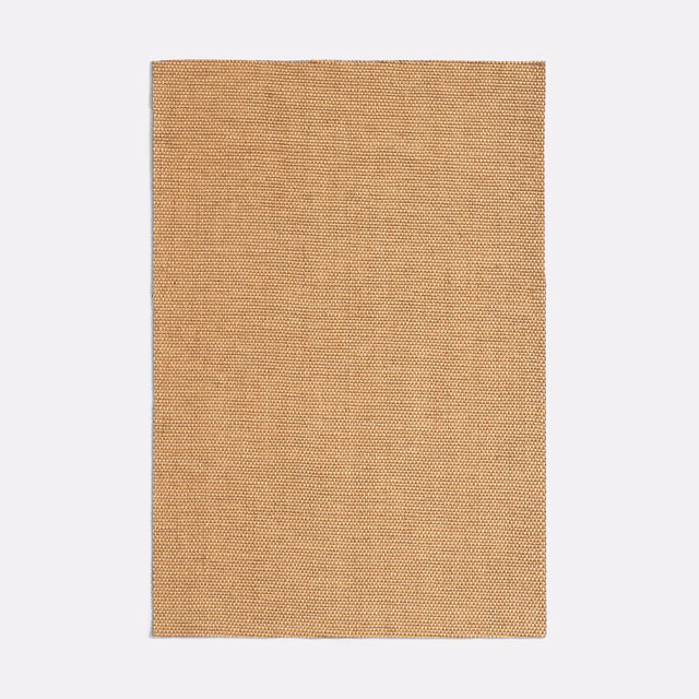 Close view of warm rattan-tan fabric with fine woven texture and subtle vertical tonal lines