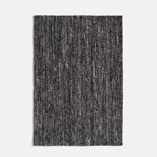 Dark slate-grey swatch with irregular vertical black-and-grey woven texture