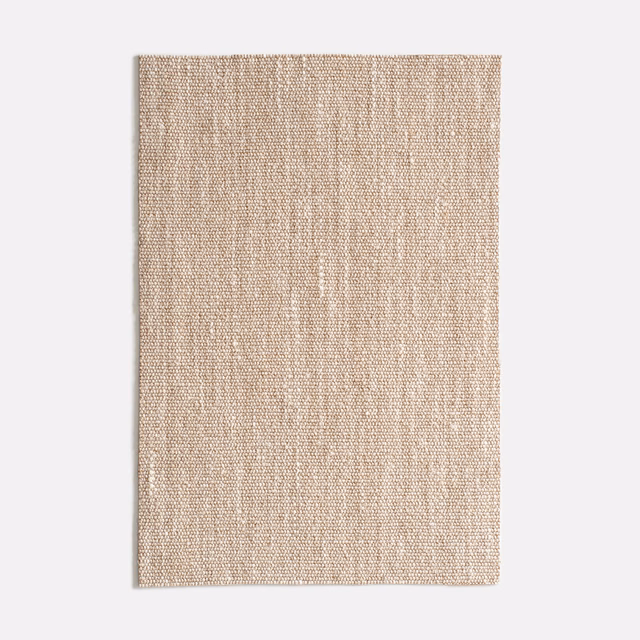 Warm beige woven upholstery fabric with fine vertical slubs and tactile texture