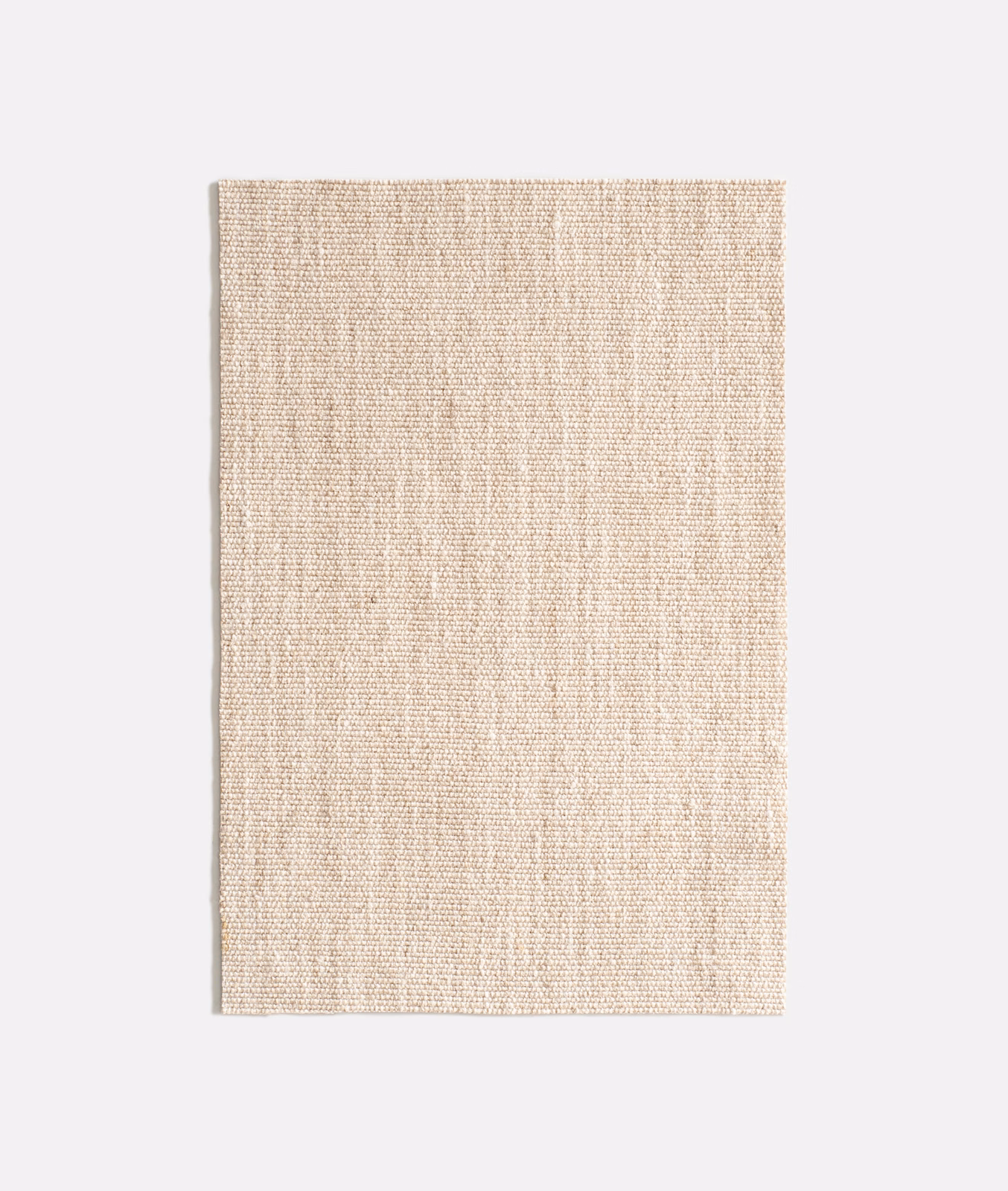 Pale natural beige woven fabric with fine slubbed vertical texture