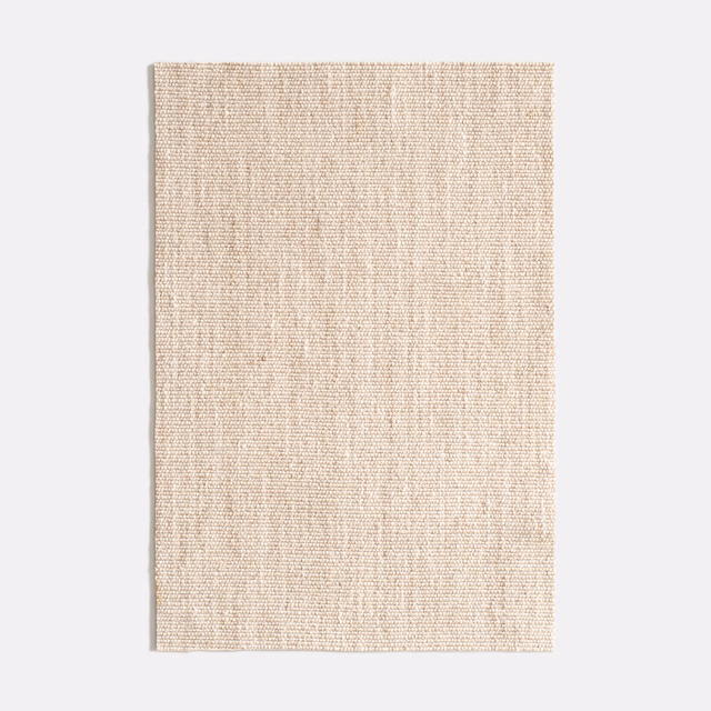 Pale natural beige woven fabric with fine slubbed vertical texture
