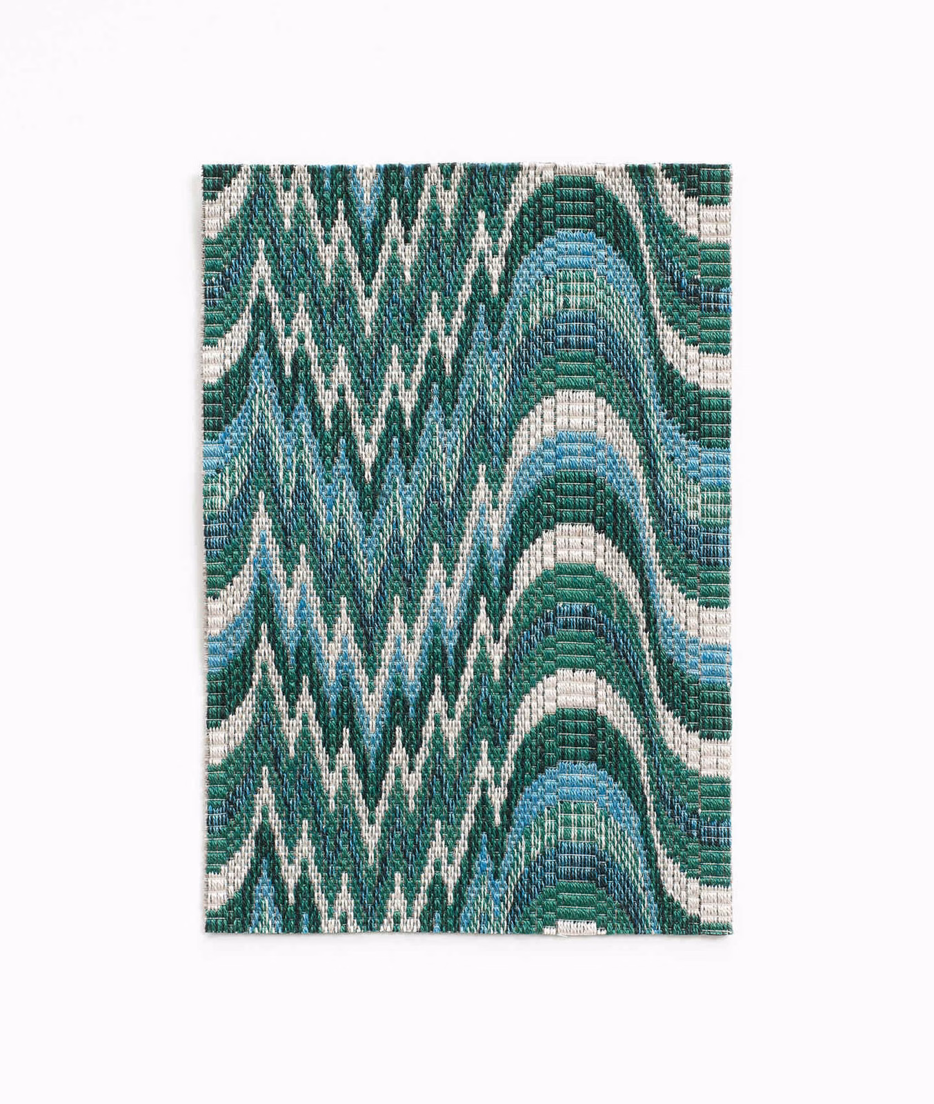 Deep teal woven swatch with ivory zigzags, blue bands and rounded arches