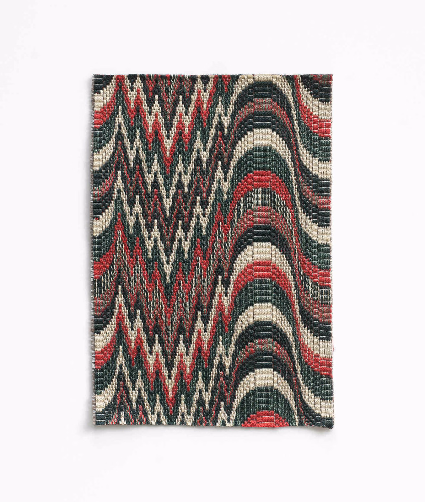 Oxblood, green and cream geometric woven swatch with zigzags and arched bands