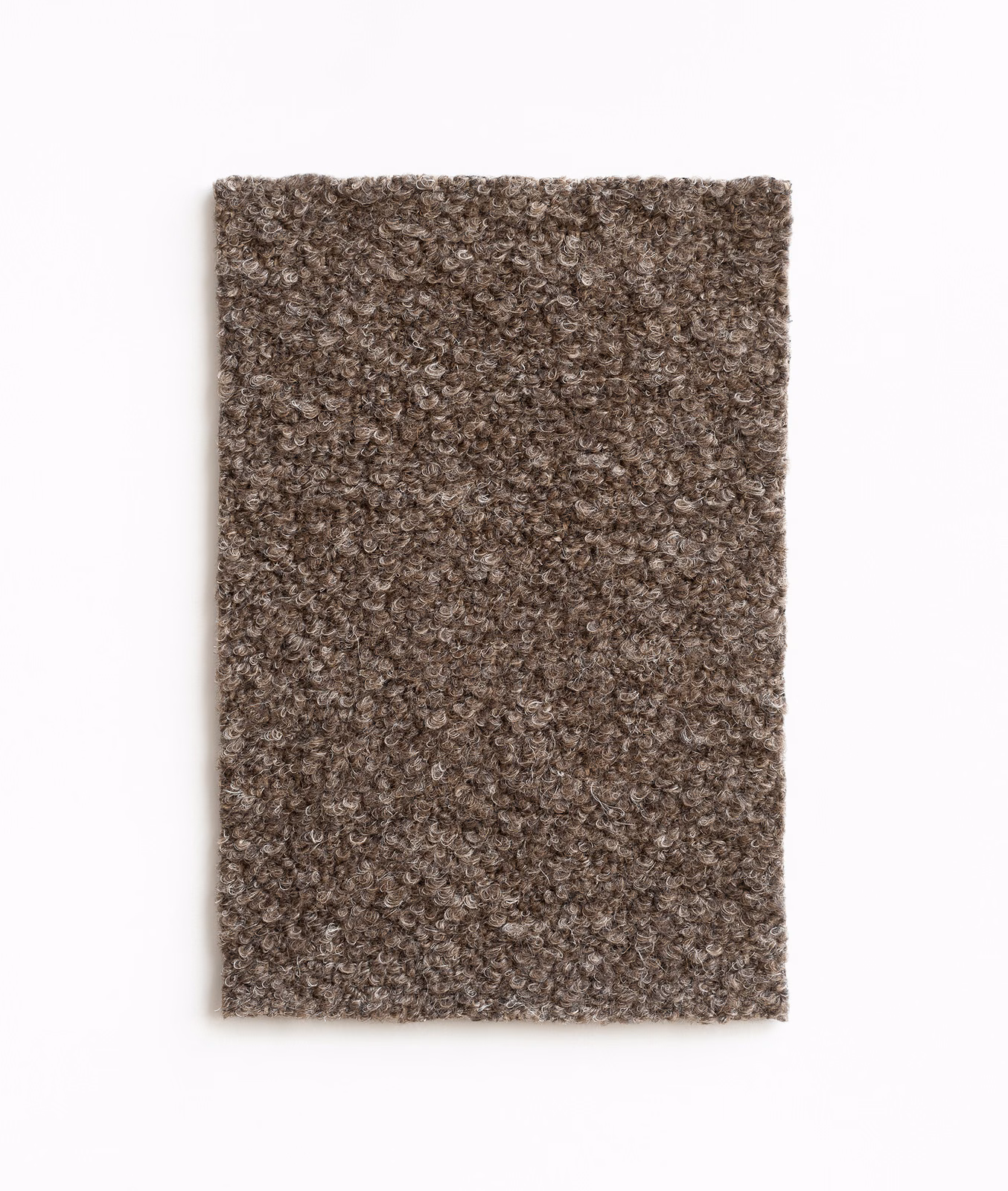 Dense brown-taupe curled upholstery texture with softly mottled boucle-like surface