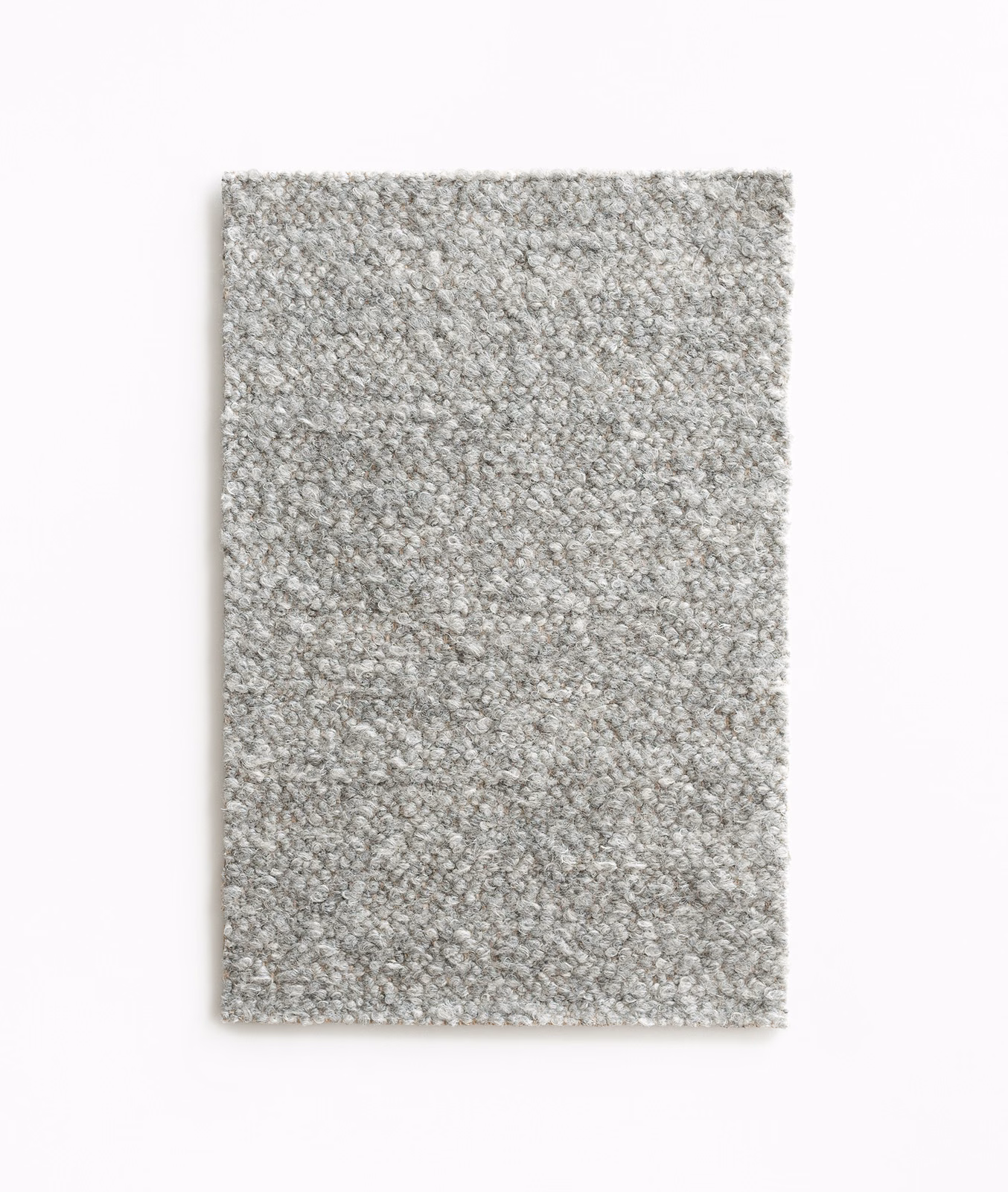 Pale warm-grey bouclé swatch with dense nubby loops and subtle flecking