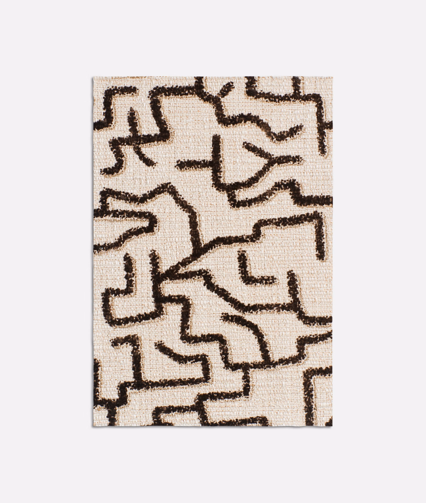 Ecru woven swatch with dark ebony-brown abstract maze-like linework and tactile texture