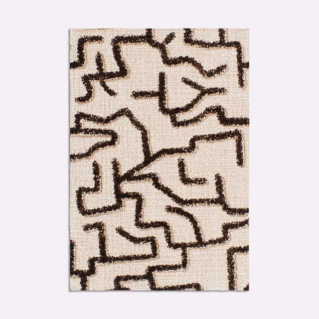 Ecru woven swatch with dark ebony-brown abstract maze-like linework and tactile texture