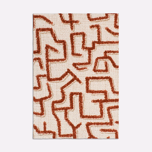 Paprika-red abstract maze lines on an ivory textured woven upholstery swatch