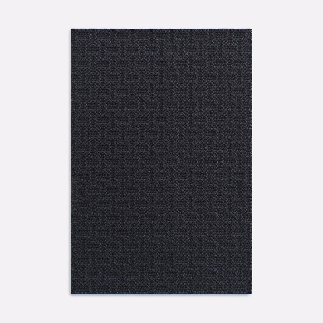 Deep charcoal-grey swatch with a tight, subtly grained woven texture