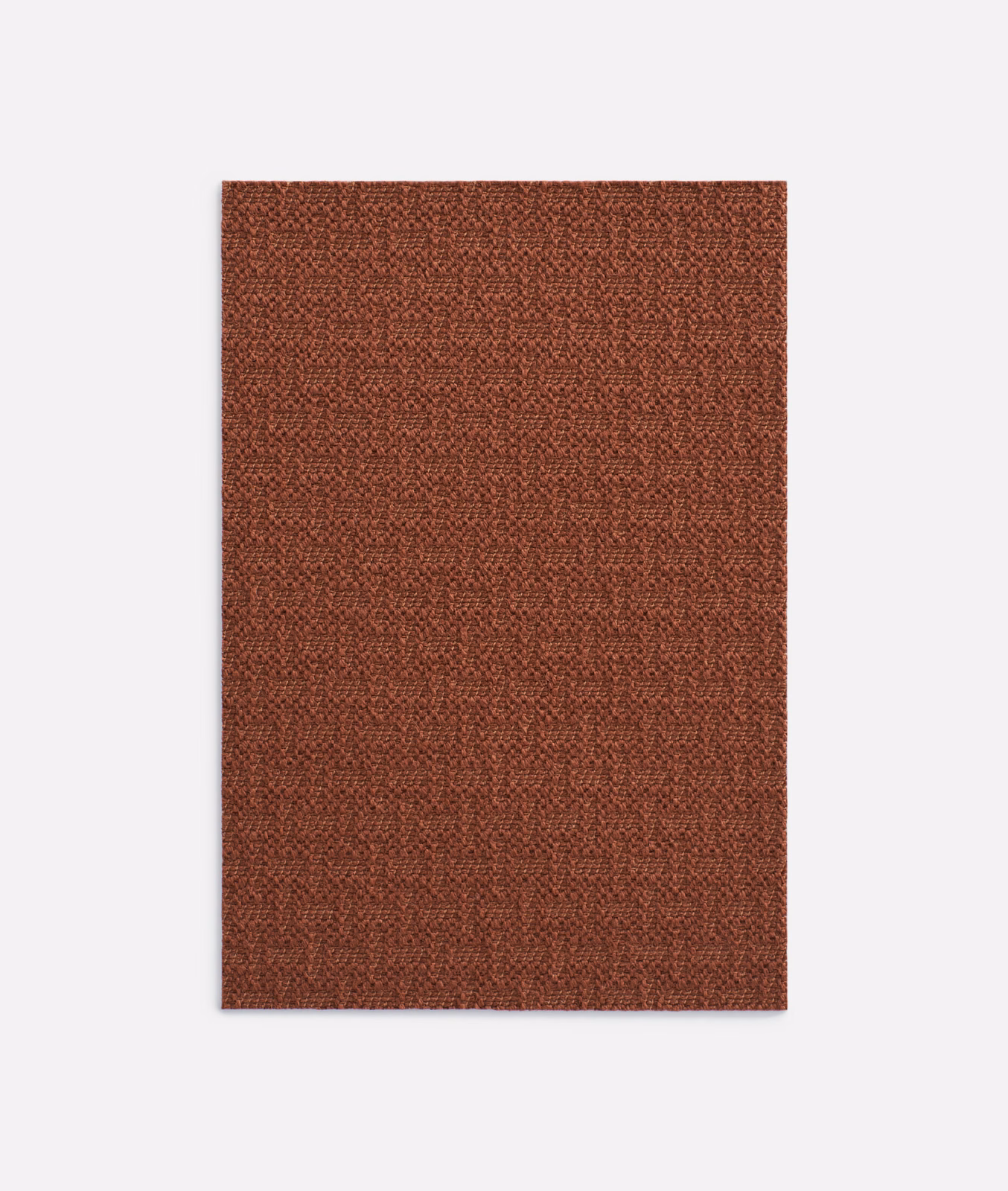 Warm russet terracotta upholstery textile with a close, pebbled woven surface